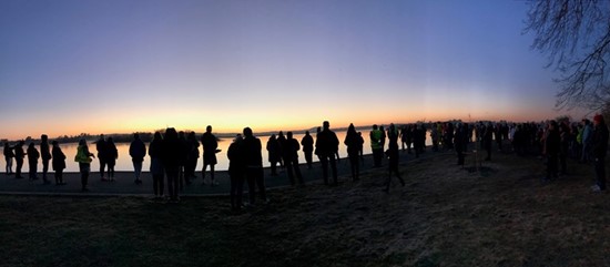 Participants standing at the Lake Wendouree edge at dawn